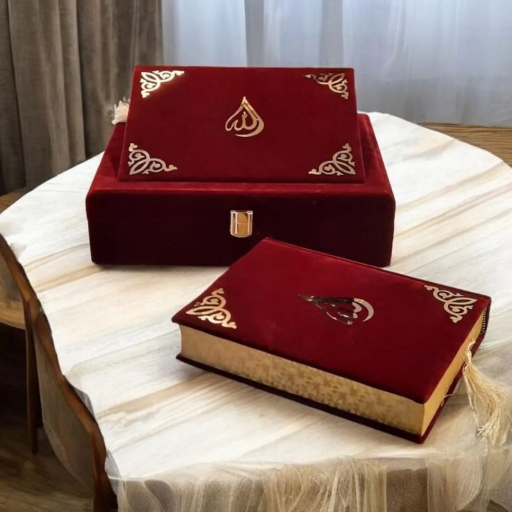 this is a Quran box it is red color and, on the table, Islamic gifting